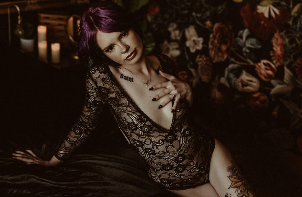 Real woman photographed during a boudoir session demonstrating confidence and natural movement in a luxury boudoir studio.