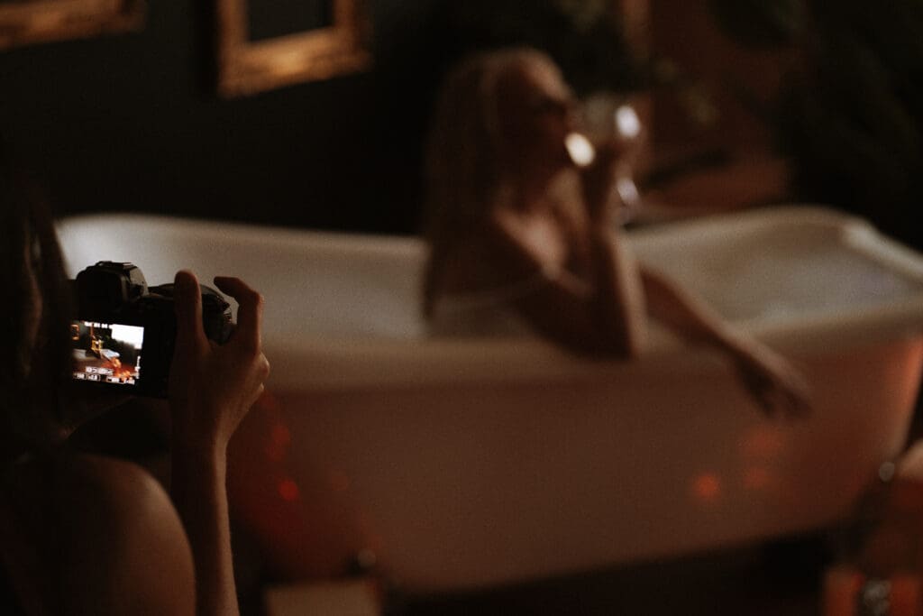 Woman posing confidently during a guided boudoir photoshoot showing intentional posing direction at Onyx and Sage Studios