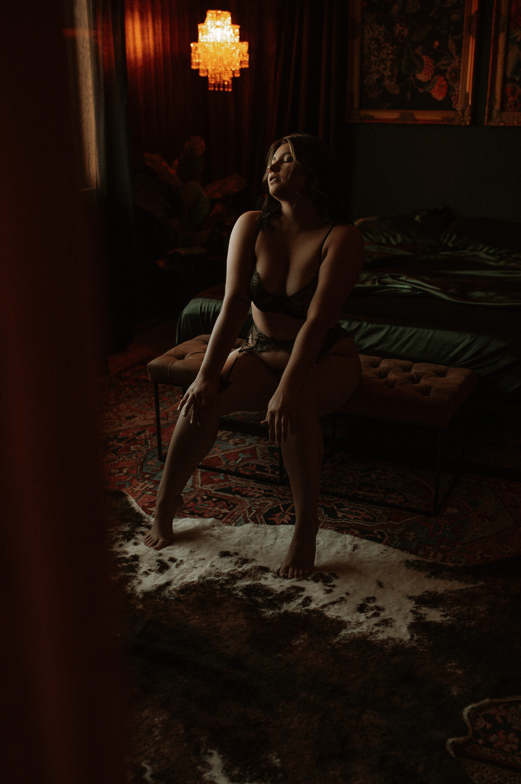 confident woman posing during boudoir session at Onyx and Sage Studios showing natural body confidence