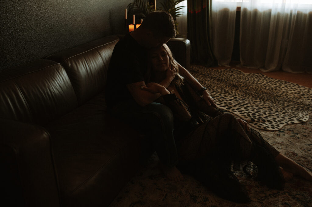 couple embracing during intimate boudoir session showing emotional connection