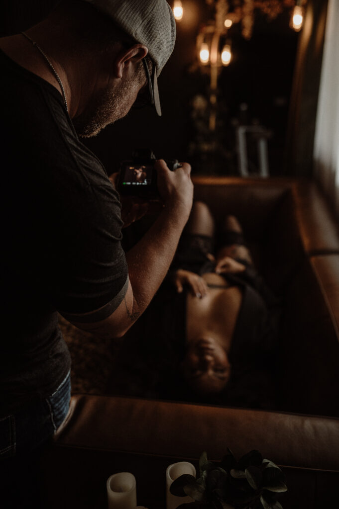 how to choose a boudoir photographer showing confident client during session at Onyx and Sage Studios