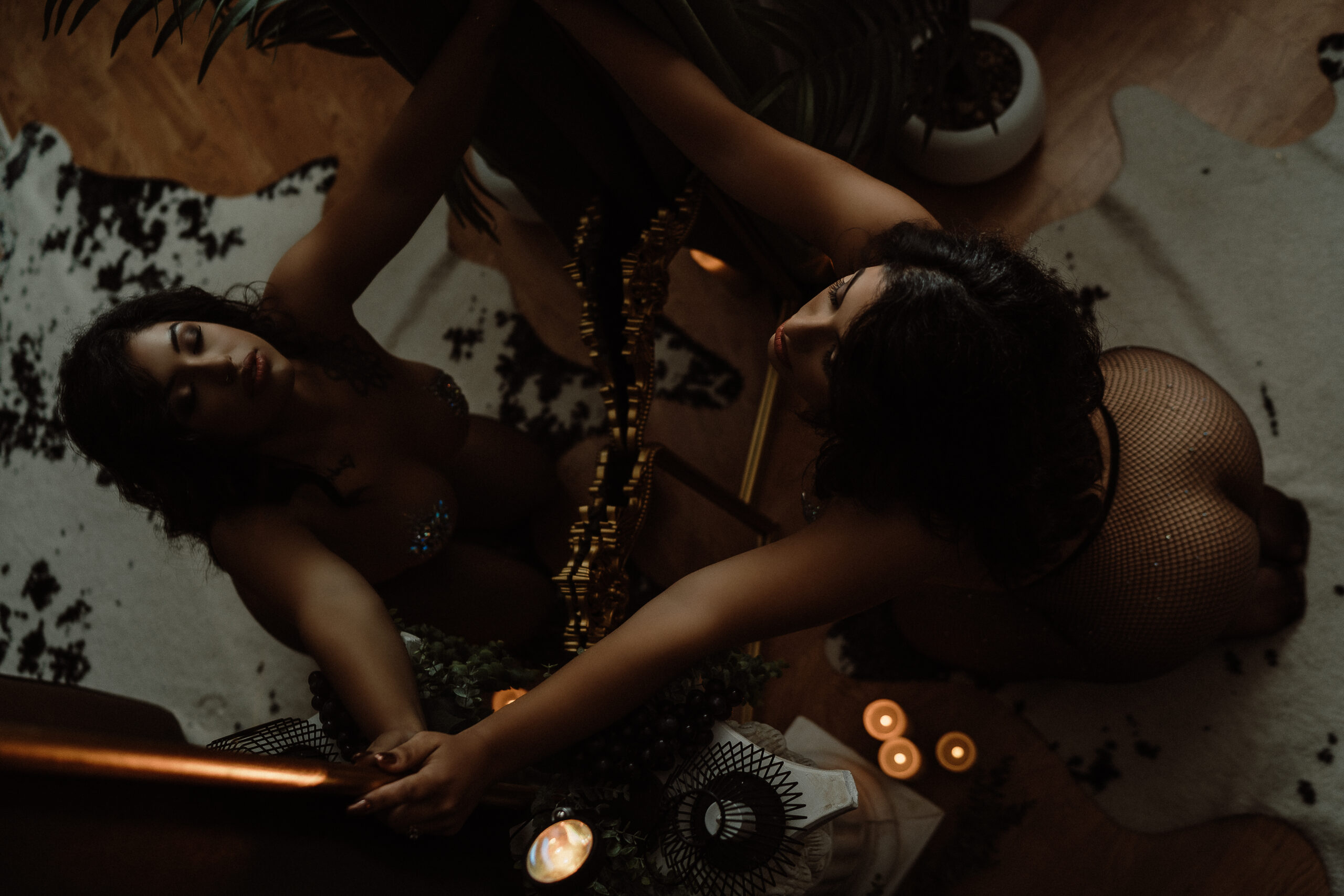 Woman feeling nervous before a boudoir session at Onyx & Sage Studios in Minnesota, sitting in soft natural light and preparing for an intimate portrait experience